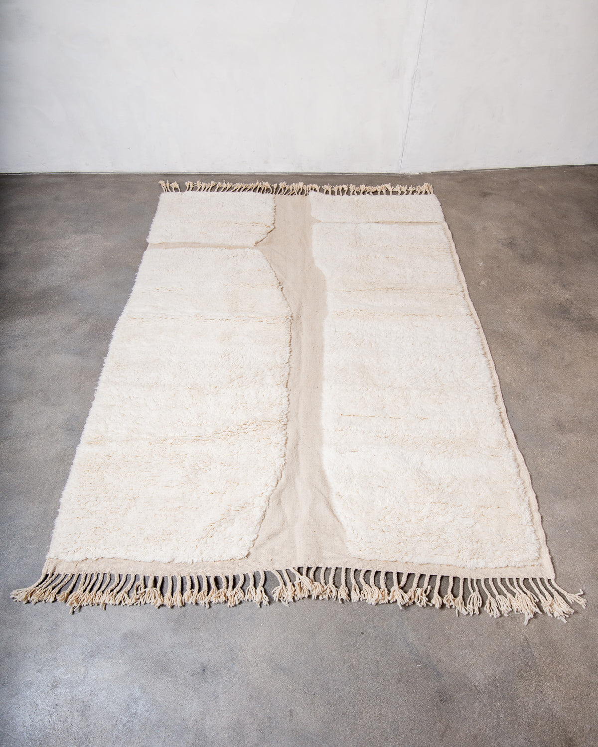 Modern, designer, handcrafted Berber rug from Morocco. Beniourain carpet with minimalist design, natural wool pile and a fluffy texture.